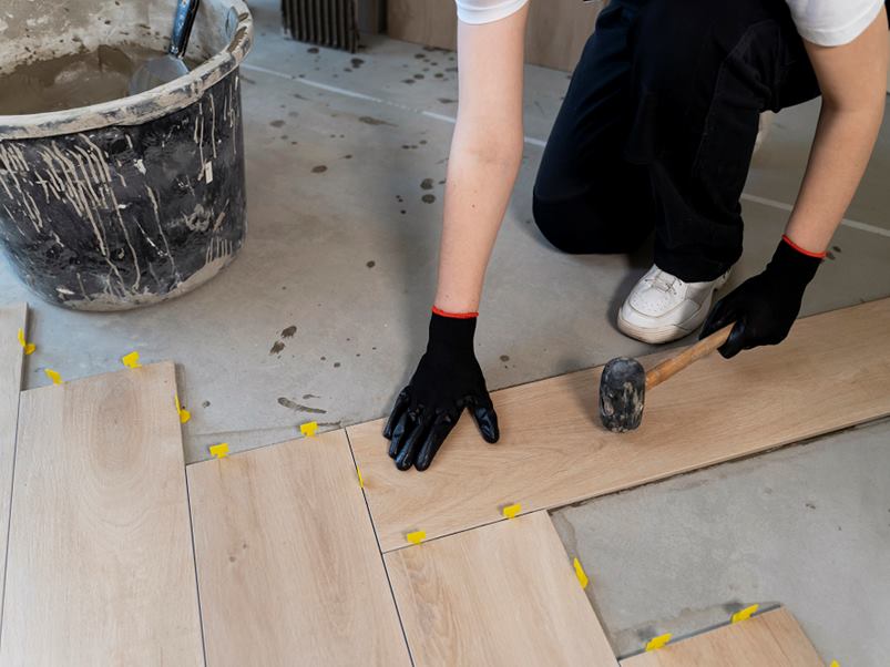 high-angle-worker-tiling-floor